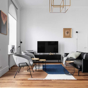 دکوراسیون سفید مشکی نشیمن مدرن با مبل مشکی و طوسی